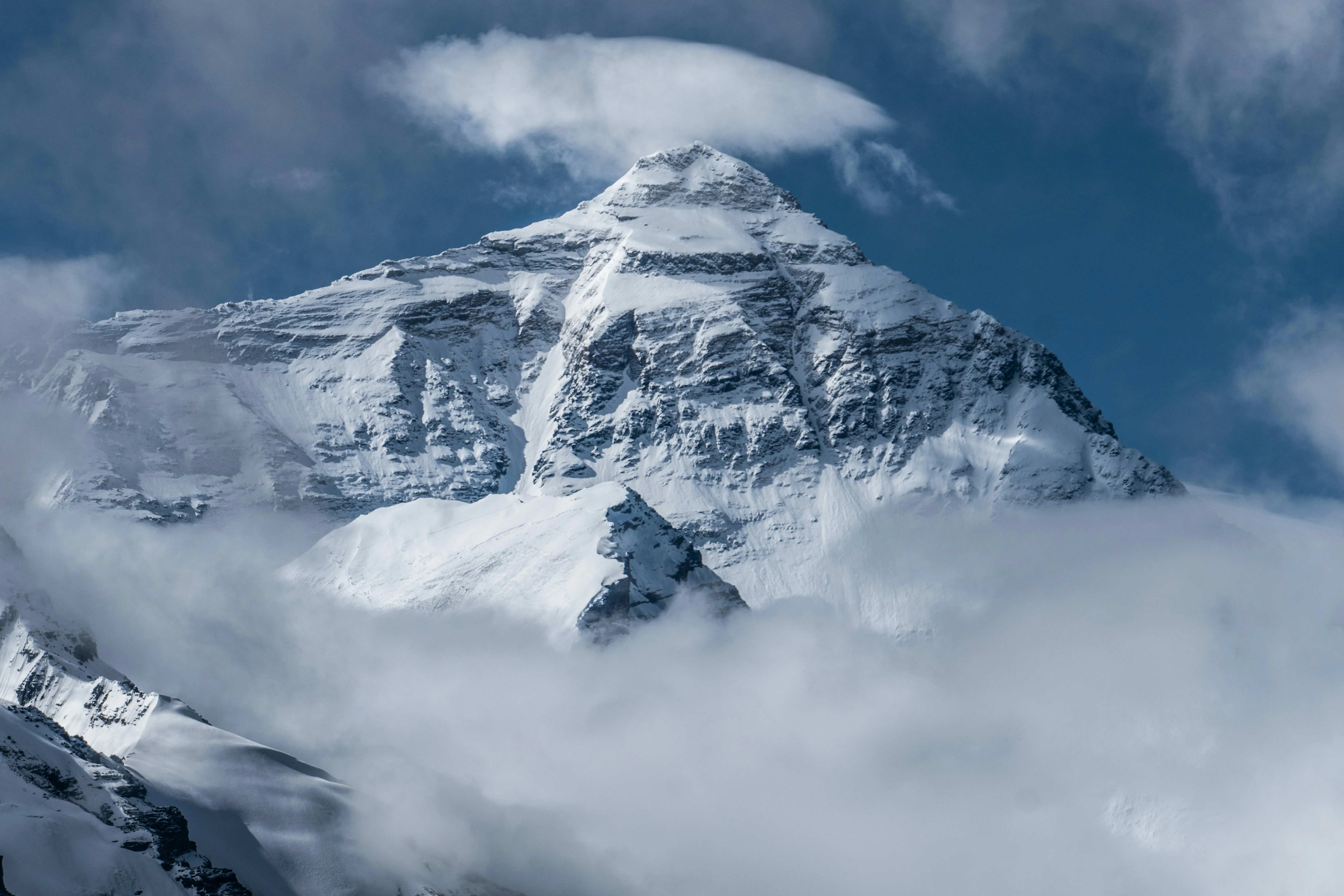 snow covered mountain under blue sky during daytime — reaching peak performance