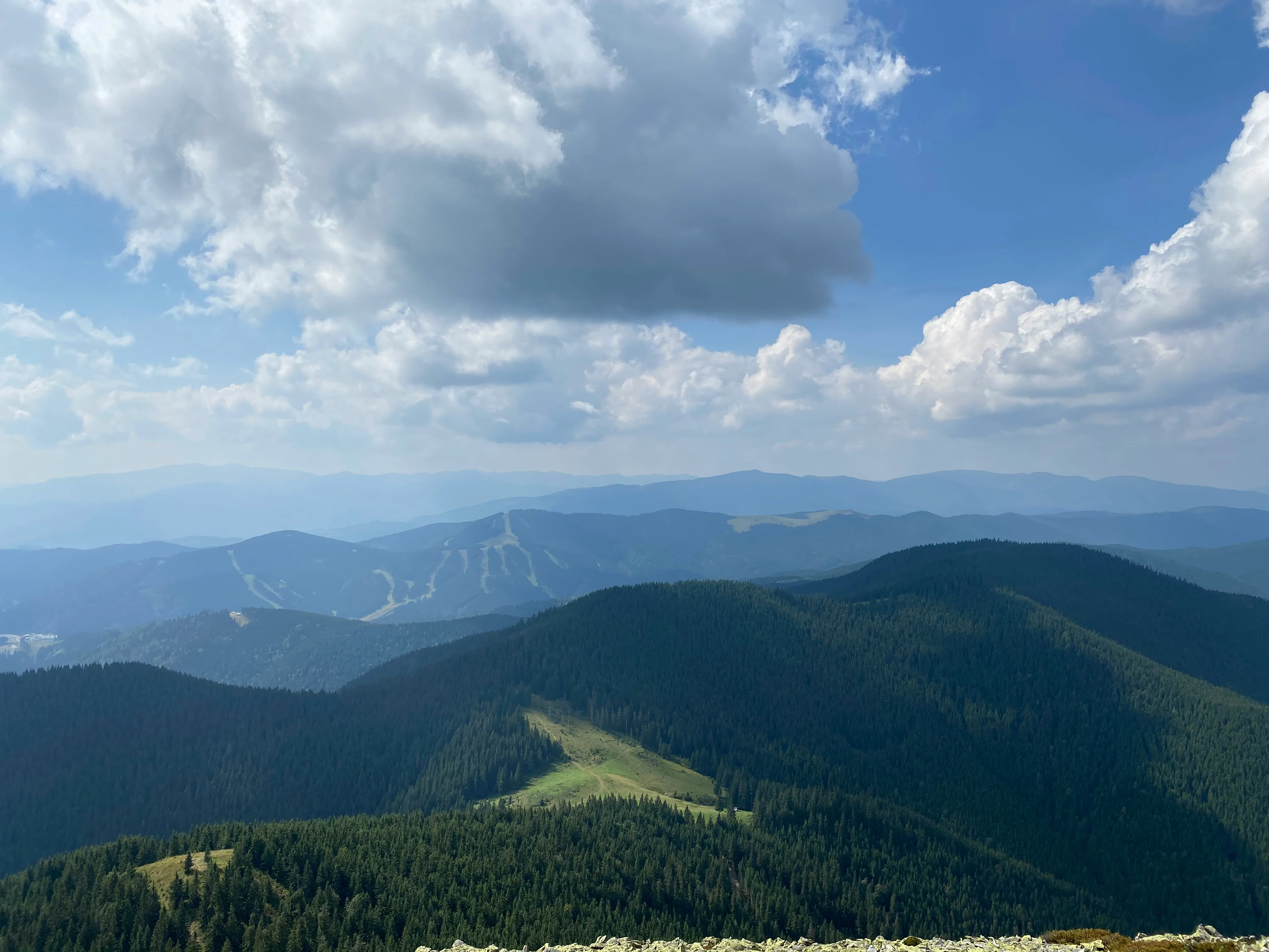 green mountains under white clouds during daytime — reaching peak performance